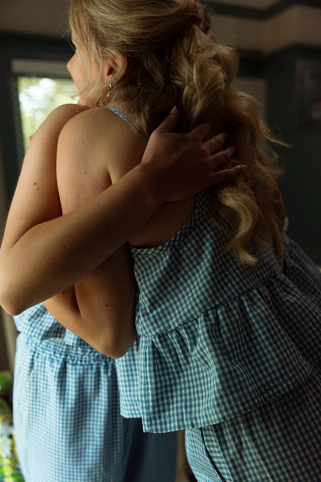 Women in gingham outfits together